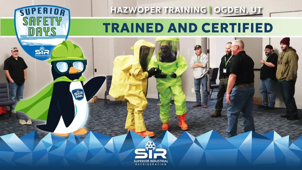 HAZWOPER Training, Ogden, UT. Trained and Certfied. Six men watching 2 more men in Hazmat Suits perform a training. Superior Safety Days emblem with the SIR Cool Penguin.